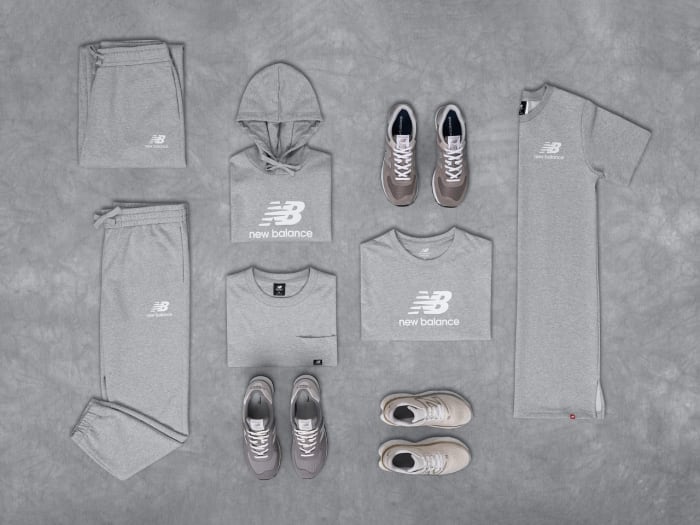 Overview of grey New Balance clothes and shoes.